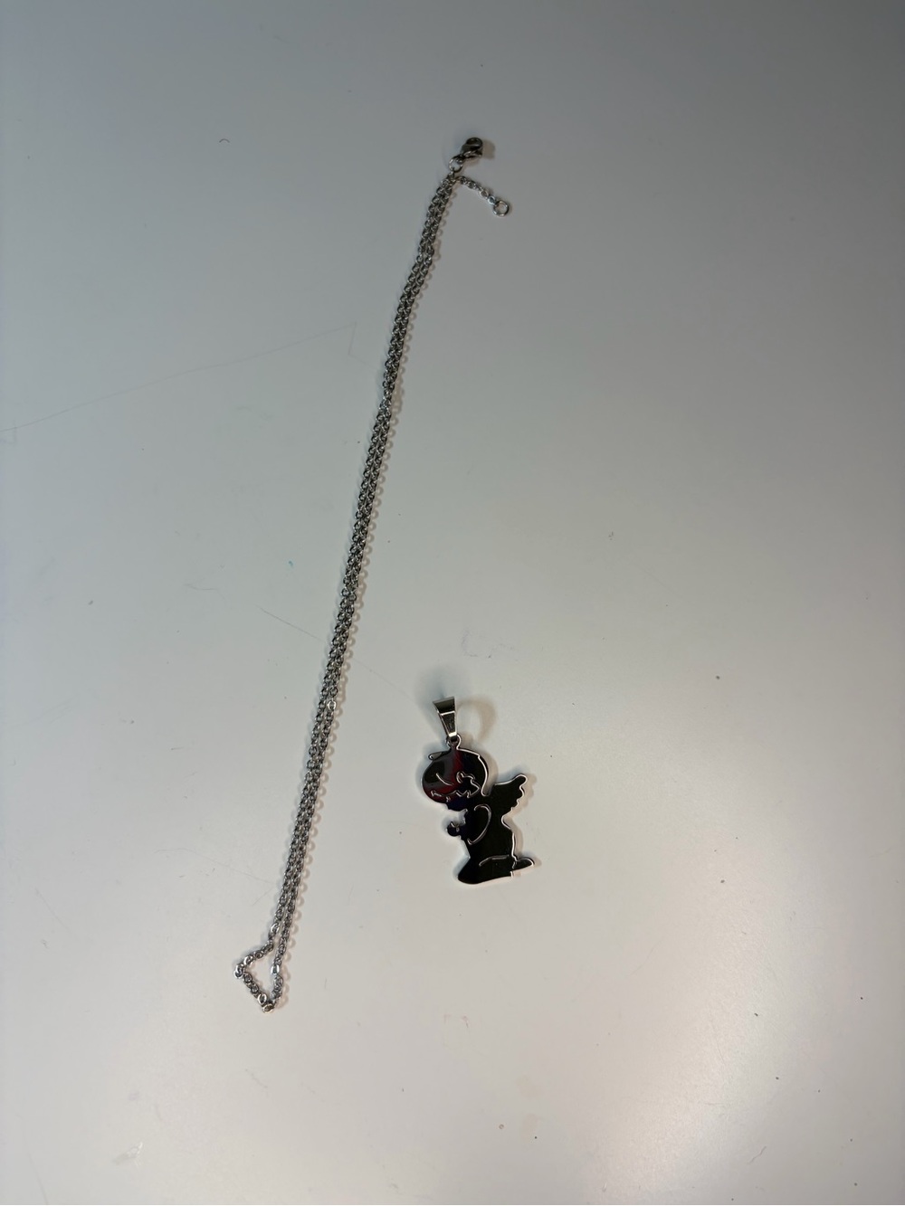 Silver-tone Necklace with Black Cartoon Silhouette Pendant